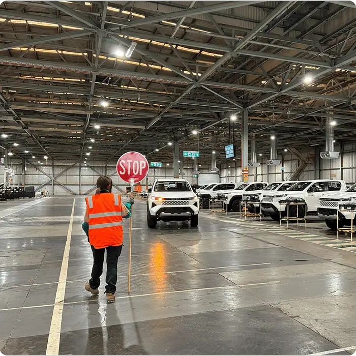 Vehicle inspection with stop sign in warehouse