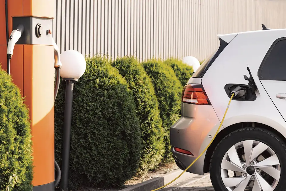 Electric vehicle charging outdoors at a commercial EV station, showcasing sustainable fleet transition in New Zealand.